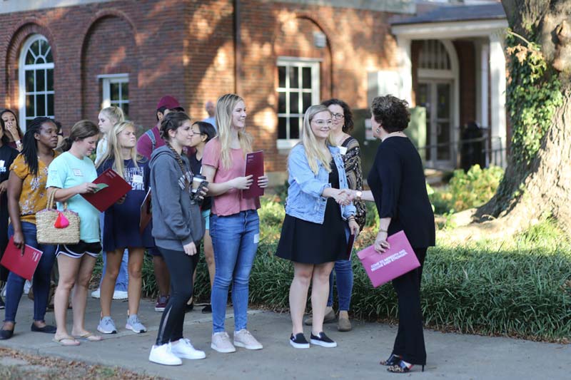 President Jo Allen greeting students at Meredith Open House