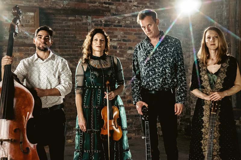 Hank Pattie, & the Current, musicians holding instruments.